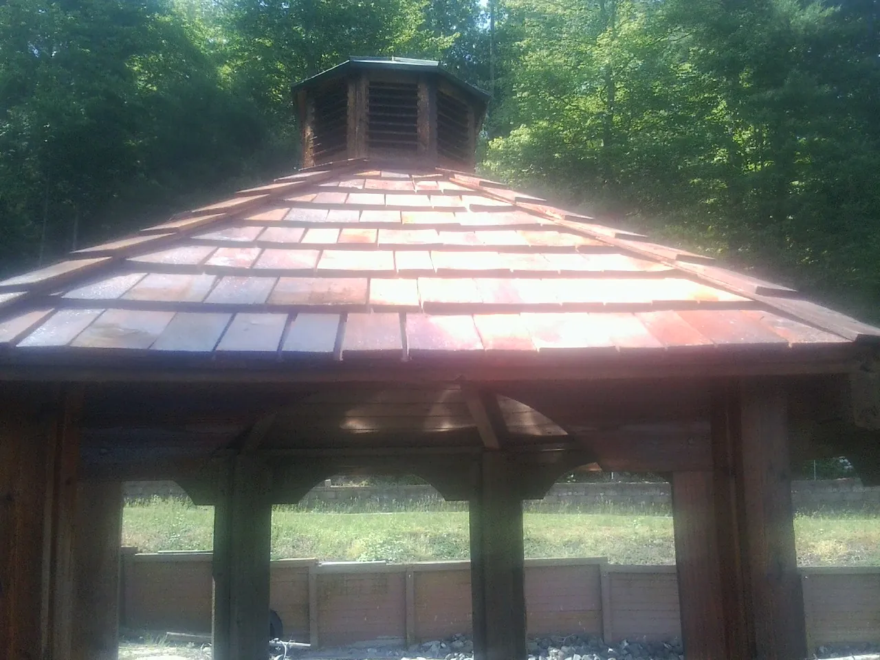 New cedar shake roof and cupola on a lakeside gazebo in Winter Springs